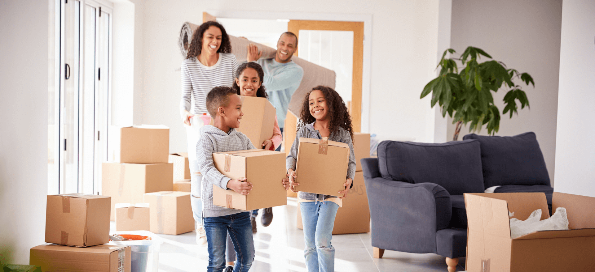 Happy family moving in to their new home thanks to MVP MortgagePros LLC