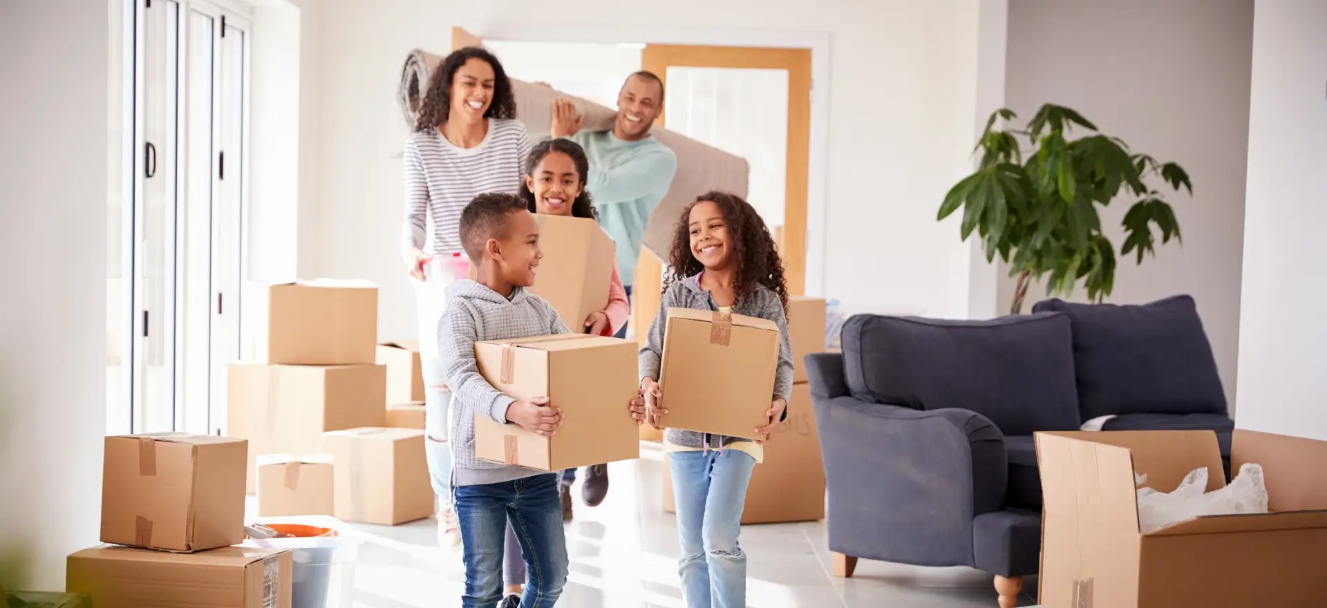 Happy family moving in to their new home thanks to MVP MortgagePros LLC